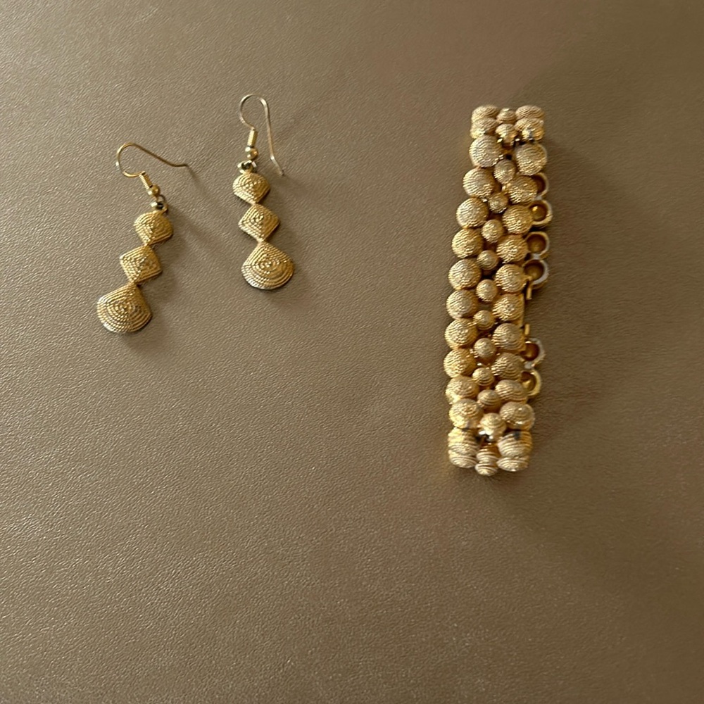 Gold matching bracelet and earrings